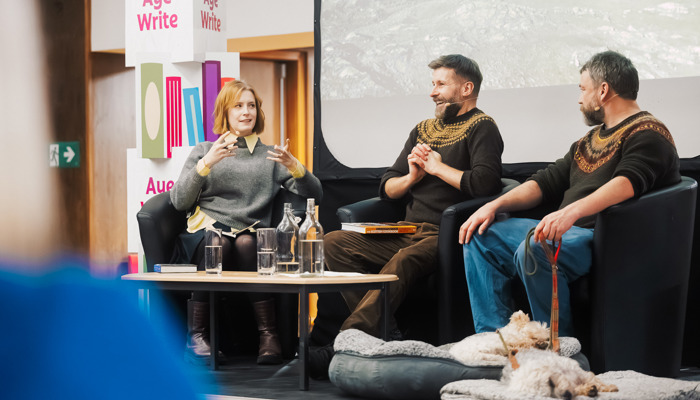 Three people sitting on a stage at Aye Write, Glasgow's Book Festival.
