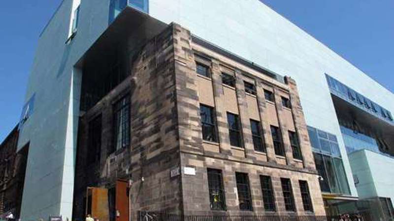 View of The Glasgow School of Art building, showing the historic stone facade alongside the modern extension.