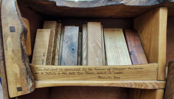 A close up on different kinds of worked wood, shaped like small rectangles and named.