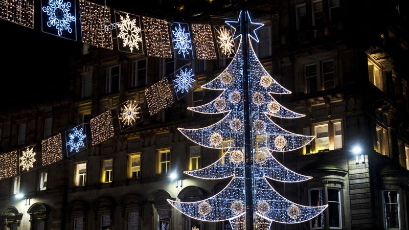 christmas lights in George Square with large tree in gold white and blue
