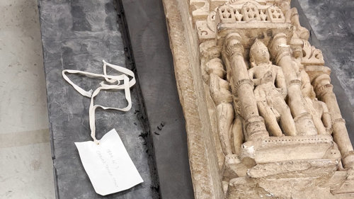 An ornately carved panel in the process of being packed in advance of repatriation.