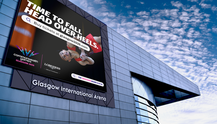 the exterior of Glasgow International Arena showing a large outdoor screen that has branding for gymnastics at Glasgow 2026 Commonwealth Games 