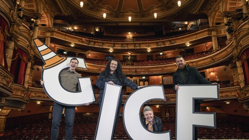 Four comedy artists set to perform at Glasgow International Comedy Festival 2025 are on stage holding giant cut out letter G I C F