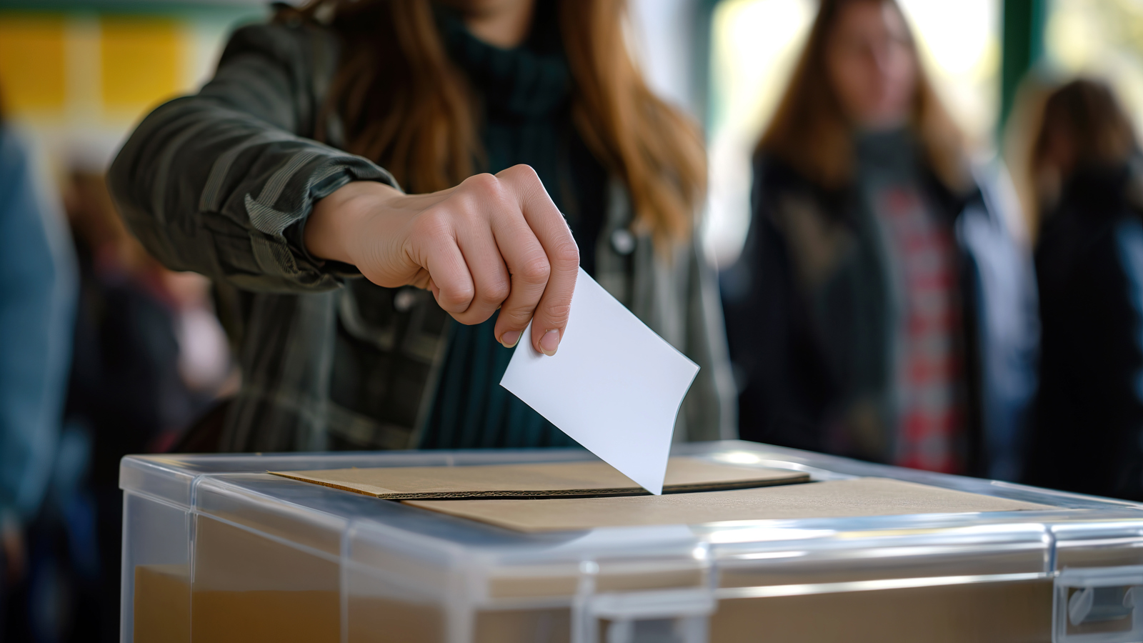 Person Depositing Voting Card Into Ballot Box