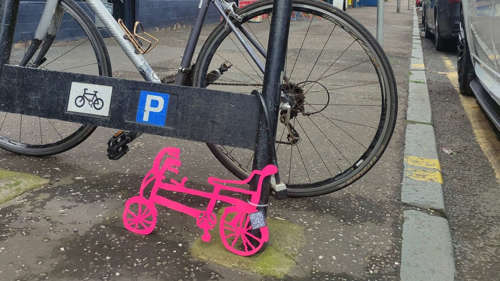 A photo of a bike in a busy street.